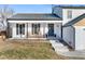 Inviting front porch with two wooden chairs, creating a welcoming entryway at 12293 W Saratoga Ave, Morrison, CO 80465