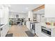 Modern kitchen with stainless steel appliances and white cabinets at 12293 W Saratoga Ave, Morrison, CO 80465