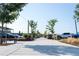 Landscaped pathway with trees, benches, and string lights at 5128 W 26Th Ave # 208, Denver, CO 80212