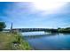 Footbridge over lake with people and ducks visible at 5128 W 26Th Ave # 208, Denver, CO 80212