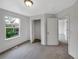 Bedroom with neutral carpet, walk in closet and an ensuite bathroom at 4548 Quandary Peak St, Brighton, CO 80601