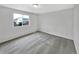 Clean bedroom with large window and plush carpet creating a clean space at 4548 Quandary Peak St, Brighton, CO 80601