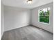 Bright bedroom with neutral carpet, white walls and a large window with natural light at 4548 Quandary Peak St, Brighton, CO 80601