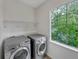 Convenient laundry room featuring modern washer and dryer units at 4548 Quandary Peak St, Brighton, CO 80601
