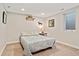 Cozy basement bedroom features neutral walls, carpet, and a comfortable bed at 3807 S Jasmine St, Denver, CO 80237