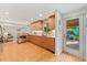 Modern kitchen featuring sleek cabinets, stainless steel appliances, and hardwood flooring at 3807 S Jasmine St, Denver, CO 80237