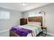 Cozy bedroom with wood furnishings, including a wooden bed frame and side table at 6071 S Ingalls St, Littleton, CO 80123