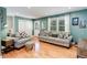 Comfortable living room featuring stylish couches, hardwood floors, and a cozy atmosphere at 6071 S Ingalls St, Littleton, CO 80123
