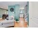 Inviting living space featuring hardwood floors, tasteful decor, and seamless transition to other rooms at 6071 S Ingalls St, Littleton, CO 80123