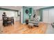 Hardwood floors throughout the expansive open concept living area adjoining the kitchen at 6071 S Ingalls St, Littleton, CO 80123