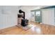 Living space featuring a wood-burning stove, adjacent to a door leading to the outside at 6071 S Ingalls St, Littleton, CO 80123
