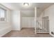 Attic room featuring carpeted floors and a staircase at 3280 Ames St, Wheat Ridge, CO 80212