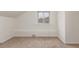 Bedroom with a window and neutral-toned carpet at 3280 Ames St, Wheat Ridge, CO 80212