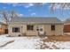 Charming single story home with neutral siding, gray roof, and small front yard at 3280 Ames St, Wheat Ridge, CO 80212