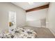 Bedroom with vaulted ceilings, wooden beam, plush carpeting and ensuite bathroom at 23585 Genesee Village Rd # E, Golden, CO 80401
