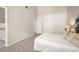 Neutral bedroom with closet and access to bathroom at 23585 Genesee Village Rd # E, Golden, CO 80401