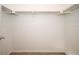 Walk-in closet featuring a carpeted floor and white walls with shelving and metal hanging rods at 23585 Genesee Village Rd # E, Golden, CO 80401