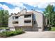 Multi-story condo with balconies and a three-car garage at 23585 Genesee Village Rd # E, Golden, CO 80401