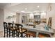 Modern kitchen with granite counters, stainless steel appliances, and a skylight, offering a bright and functional space at 23585 Genesee Village Rd # E, Golden, CO 80401