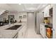 Modern kitchen with granite countertops, white cabinets, and stainless steel appliances offers efficient workflow at 23585 Genesee Village Rd # E, Golden, CO 80401