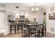 Open kitchen featuring granite countertops, stainless steel appliances, and a bar with seating at 23585 Genesee Village Rd # E, Golden, CO 80401