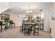Open floor plan with a cozy dining area leading into a well-lit kitchen for an inviting home at 23585 Genesee Village Rd # E, Golden, CO 80401