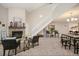Open living room with vaulted ceilings, fireplace, and neutral tones, creating a welcoming space at 23585 Genesee Village Rd # E, Golden, CO 80401
