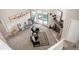 An aerial view of the living room with fireplace and seating at 23585 Genesee Village Rd # E, Golden, CO 80401