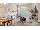 Spacious living area with fireplace, ample seating, and sliding glass doors leading to an outdoor balcony at 23585 Genesee Village Rd # E, Golden, CO 80401