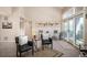 Airy living room boasts lots of natural light, offering comfortable seating and access to outdoor living at 23585 Genesee Village Rd # E, Golden, CO 80401