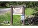 Community sign for Genesee Village listing buildings 9, 10, 15, and 16 at 23585 Genesee Village Rd # E, Golden, CO 80401