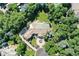 Expansive property featuring a grand residence surrounded by mature trees, manicured landscaping, and circular driveway with fountain at 4736 S Fillmore Ct, Cherry Hills Village, CO 80113