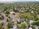Expansive aerial view of community with mature trees and neighborhood pool and tennis courts at 4484 S Granby Ct, Aurora, CO 80015