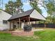 Backyard featuring a covered patio with an outdoor kitchen and brick accents at 4484 S Granby Ct, Aurora, CO 80015