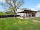Backyard featuring covered patio, well maintained lawn, and privacy fence at 4484 S Granby Ct, Aurora, CO 80015