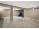 Finished basement featuring a brick fireplace and neutral carpeting at 4484 S Granby Ct, Aurora, CO 80015