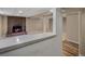 Finished basement featuring a brick fireplace and a view of the rec area with a countertop bar at 4484 S Granby Ct, Aurora, CO 80015