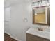 Updated bathroom with a framed mirror and brushed gold fixtures at 4484 S Granby Ct, Aurora, CO 80015