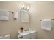 Bathroom with white vanity, framed mirror, and modern lighting fixture at 4484 S Granby Ct, Aurora, CO 80015