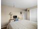 Bedroom featuring a bed, desk and closet with sliding doors at 4484 S Granby Ct, Aurora, CO 80015