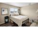 Bedroom with a full sized bed and furniture and window at 4484 S Granby Ct, Aurora, CO 80015