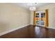 Well-lit dining room with access to the backyard through French doors and hardwood floors at 4484 S Granby Ct, Aurora, CO 80015