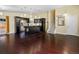 Spacious area featuring an open concept living and kitchen area with dark wood floors at 4484 S Granby Ct, Aurora, CO 80015
