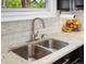 Stainless steel undermount kitchen sink, granite countertops and stainless faucet at 4484 S Granby Ct, Aurora, CO 80015