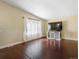 Bright living room with large windows, neutral walls, and a contemporary media console at 4484 S Granby Ct, Aurora, CO 80015
