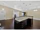 Spacious living area with vaulted ceilings that integrates the kitchen and living room at 4484 S Granby Ct, Aurora, CO 80015