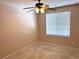 Spacious bedroom featuring a ceiling fan and window blinds at 11729 Elkhart St, Commerce City, CO 80603