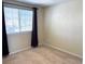 Bright bedroom with neutral walls and carpeting at 11729 Elkhart St, Commerce City, CO 80603