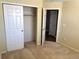 Bright bedroom with double door closet and neutral carpeting at 11729 Elkhart St, Commerce City, CO 80603