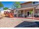 Large backyard featuring a deck, patio, and well-maintained landscaping at 9700 W 88Th Pl, Westminster, CO 80021